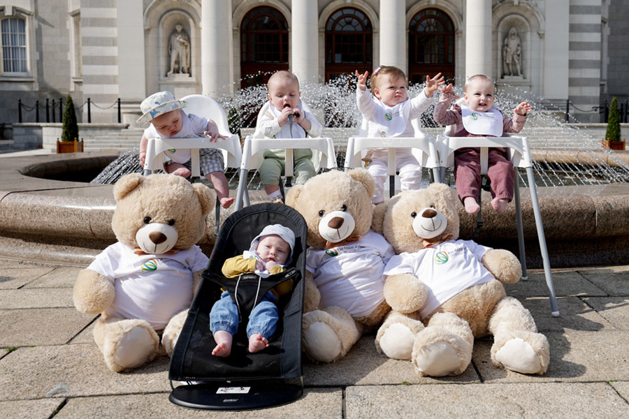 Five infants from the new cohort launch 2024 outside government buildings